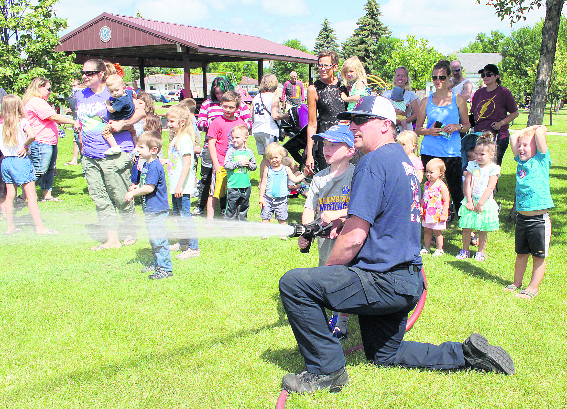 Practicing being a firefighter Thief River Falls Times & Northern